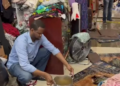 Customers drenched at Somali Mall after Saturday’s downpour leaks via broken roof